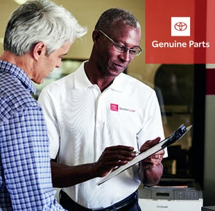 Toyota advisor helping customer | Toyota of Katy in Katy TX