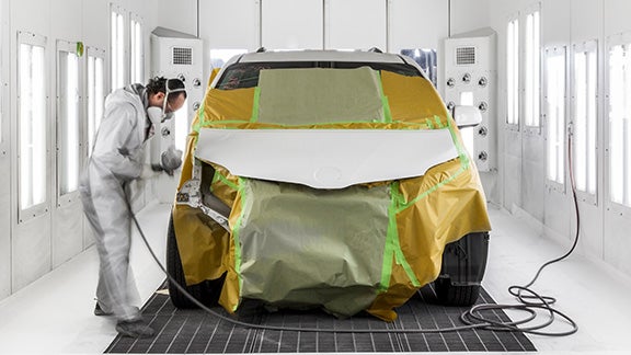 Collision Center Technician Painting a Vehicle | Toyota of Katy in Katy TX