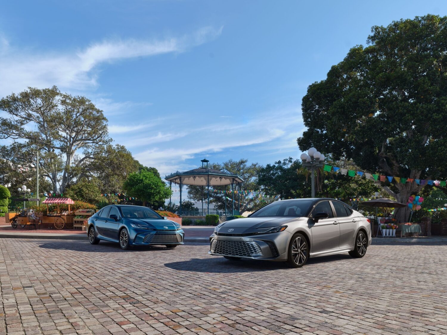 A group shot of the 2026 Toyota Camry in blue and silver