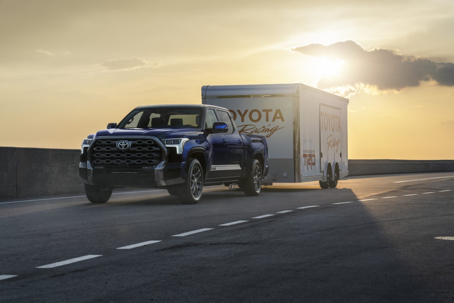 A 2026 Toyota Tundra Platinum towing a trailer on the highway