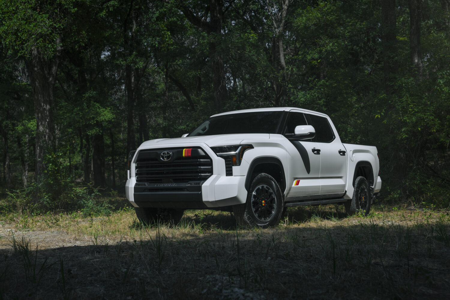 A white 2026 Toyota Tundra TRD nestled in the woods