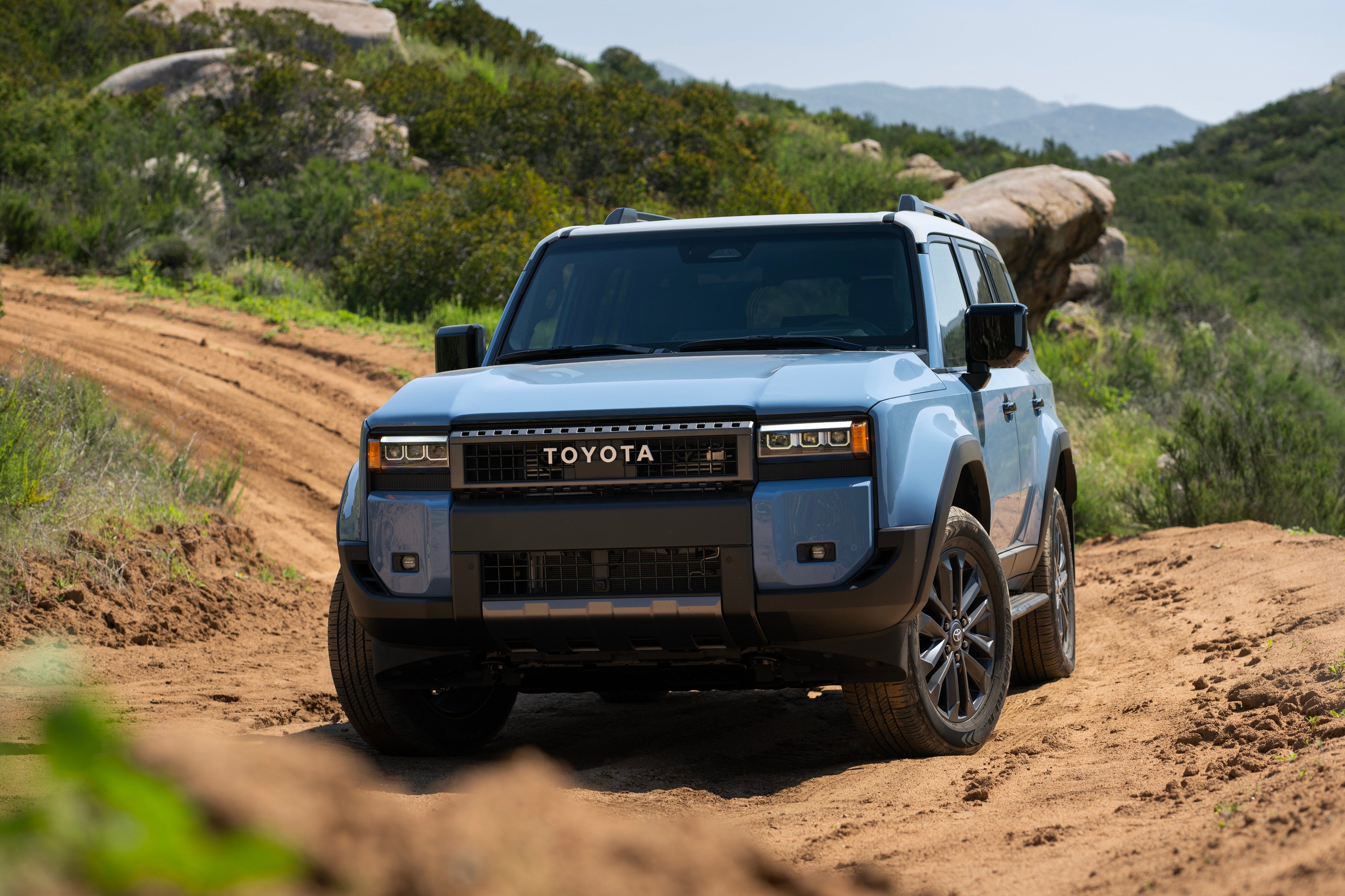 A baby blue 2027 Toyota Land Cruiser